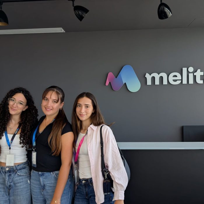 students posing in front of the Melita offices